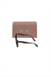 Current Boutique-Miu Miu - Beige Translucent Frames w/ Brown Lenses